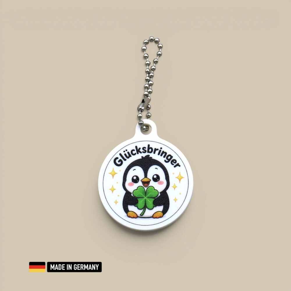 pinguin baby glücksbringer schlüsselanhänger mit glücks kleeblatt polartier