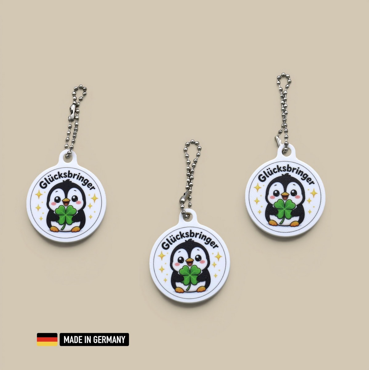 pinguin baby glücksbringer schlüsselanhänger mit glücks kleeblatt polartier