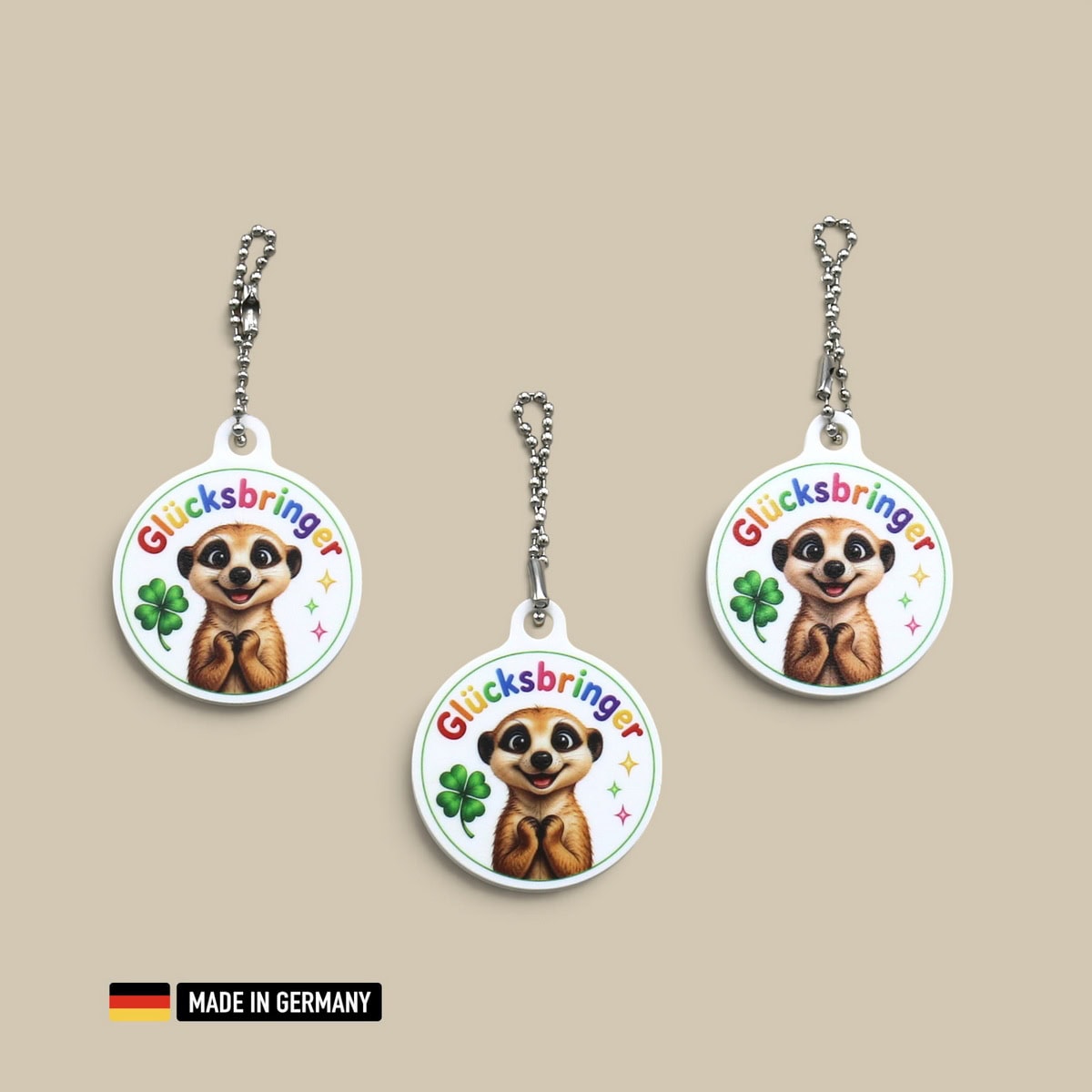 erdmännchen glücksbringer schlüsselanhänger mit glücks kleeblatt
