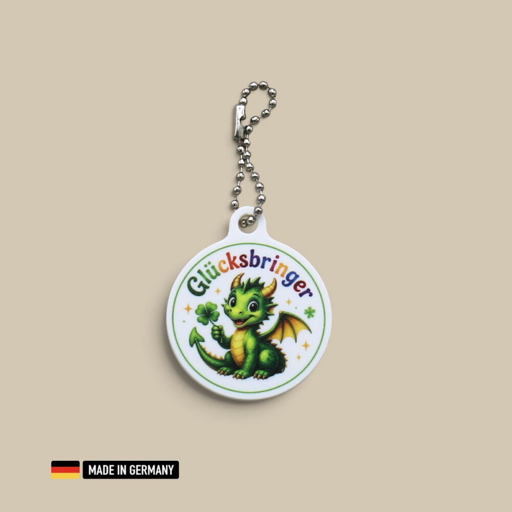 drachenbaby mit hörner und flügel glücksbringer schlüsselanhänger mit glücks kleeblatt