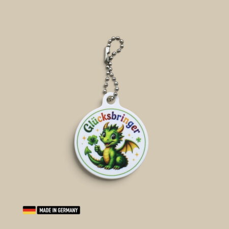 drachenbaby mit hörner und flügel glücksbringer schlüsselanhänger mit glücks kleeblatt