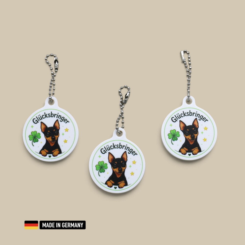 zwergpinscher welpe glücksbringer schlüsselanhänger mit glücks kleeblatt