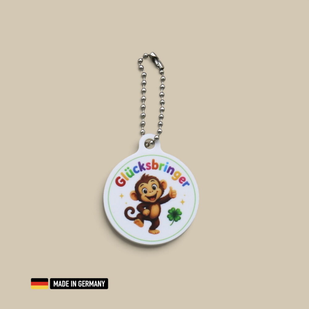 affenbaby glücksbringer schlüsselanhänger mit glücks kleeblatt